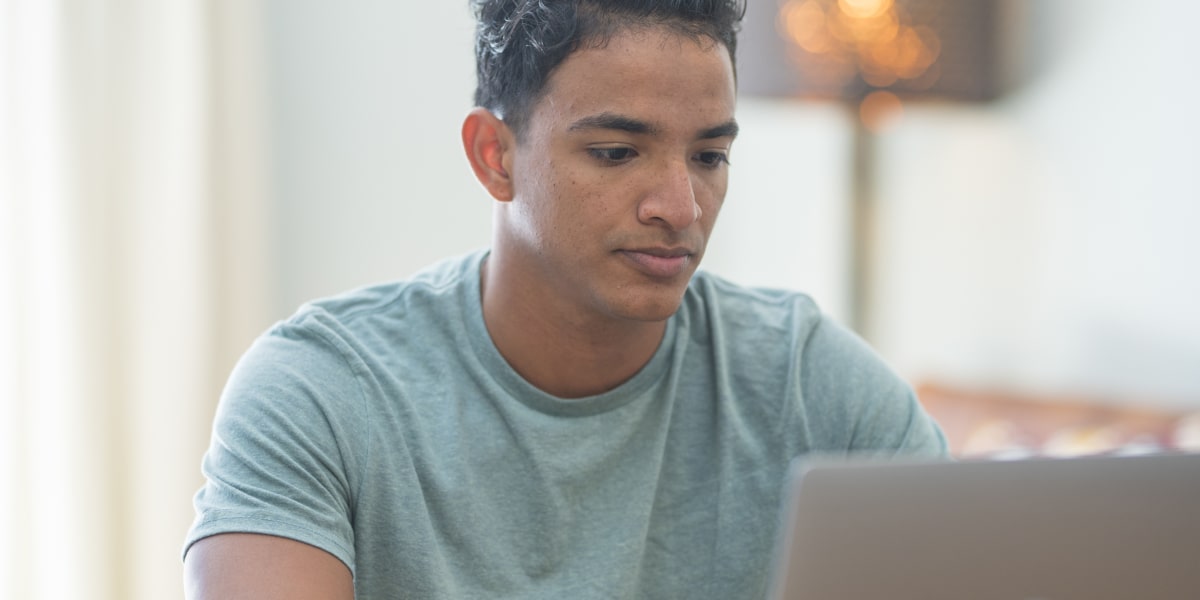 Digital marketing analyst skills A digital marketing analyst working on a laptop